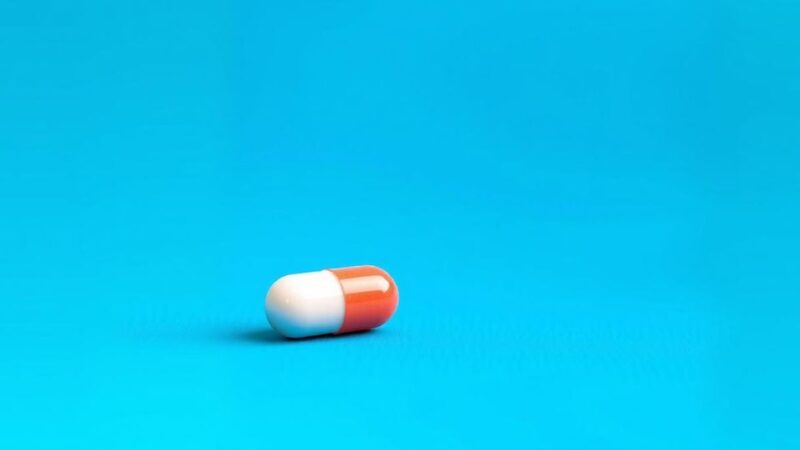 Tablet with a background of vibrant blue and green hues symbolizing hope in lung cancer treatment.